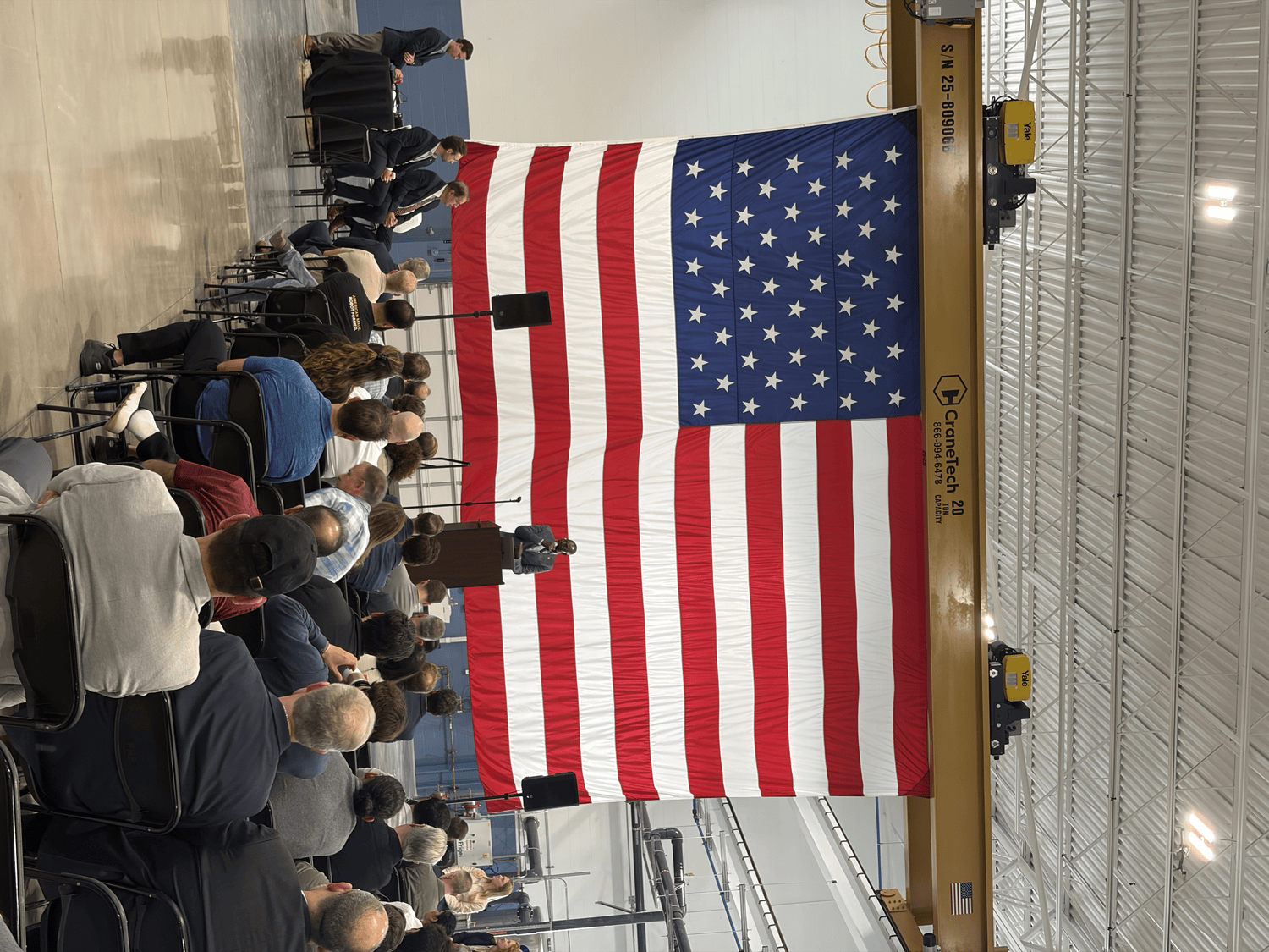 A large United States flag in the summit hall during the keynote
