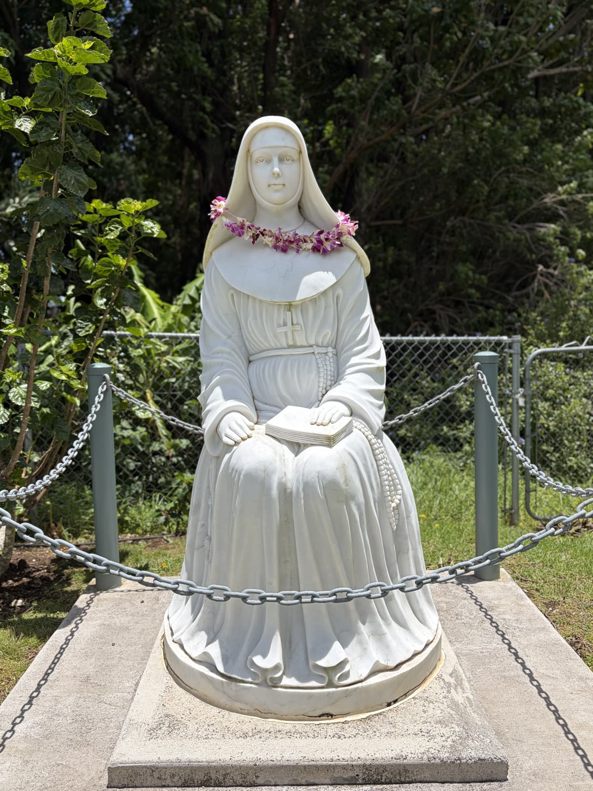 Statue of St. Marianne Cope with orchid lei