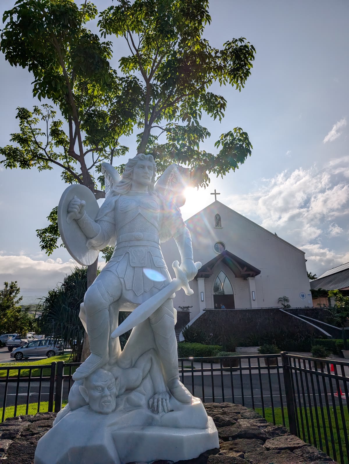 Statue of St. Michael the Archangel with sun flare, Kailua-Kona